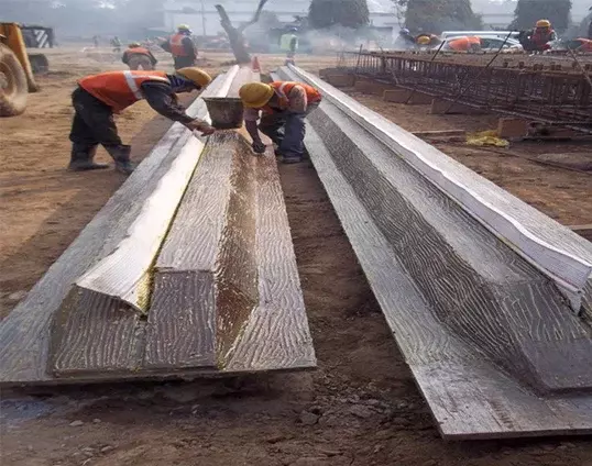 Two men fix PVC Water Stoppers within stop-ends at a diaphragm wall construction site